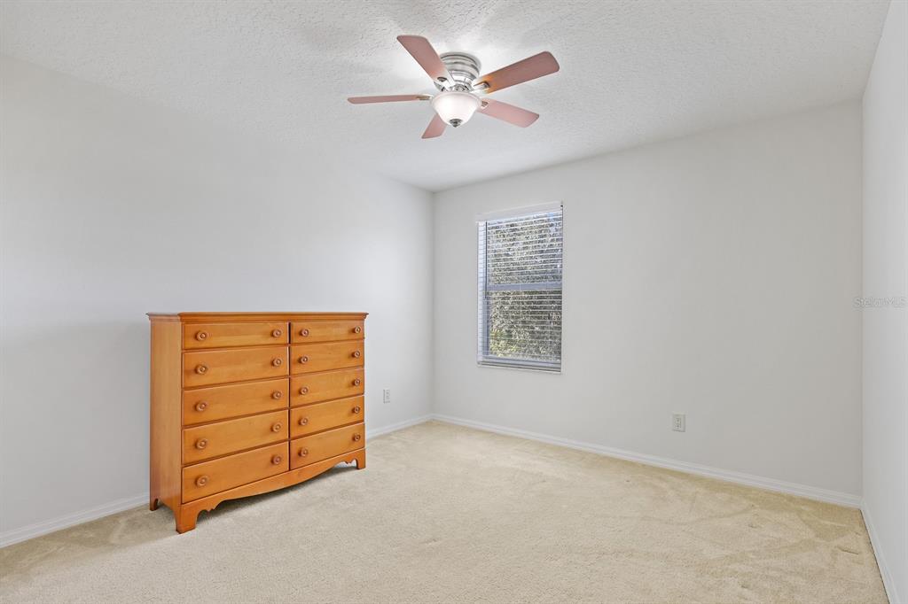 1411 Main Street Valrico, FL 33594 - Photo 25 of 44 an empty room with closet and ceiling fan