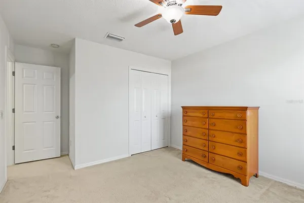 a view of an empty room with a cabinet