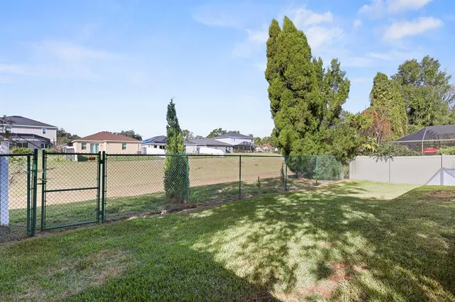 a view of a house with a yard porch and sitting area
