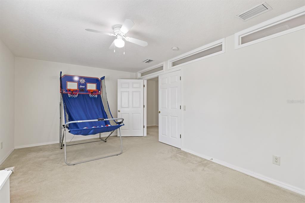 1411 Main Street Valrico, FL 33594 - Photo 33 of 44 a living room with furniture and a ceiling fan