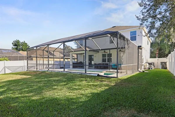 a view of a house with a yard porch and sitting area