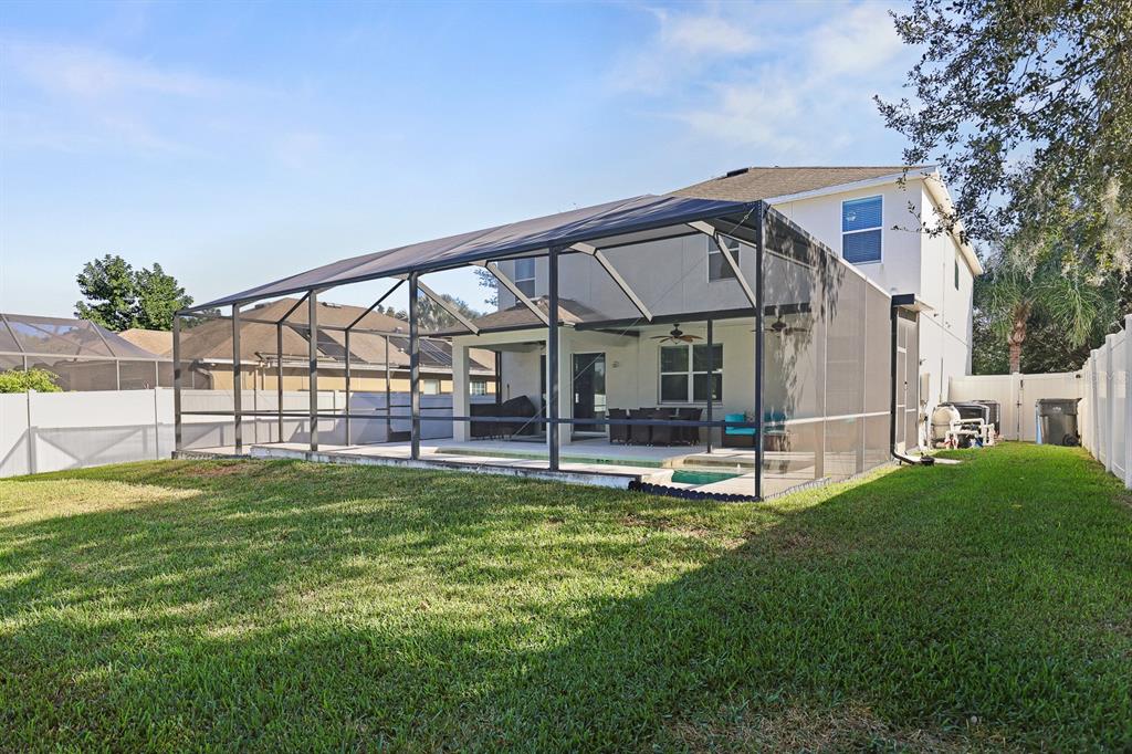 1411 Main Street Valrico, FL 33594 - Photo 4 of 44 a view of a house with a yard porch and sitting area