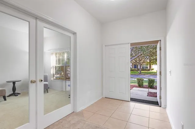 a bathroom with a glass door and a bathtub