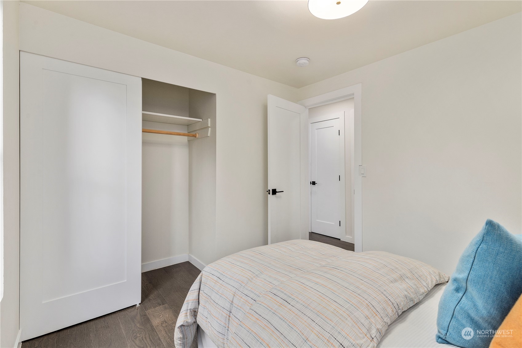 21613 6th Avenue West Bothell, WA 98021 - Photo 16 of 37 a bedroom with a bed and wooden floor