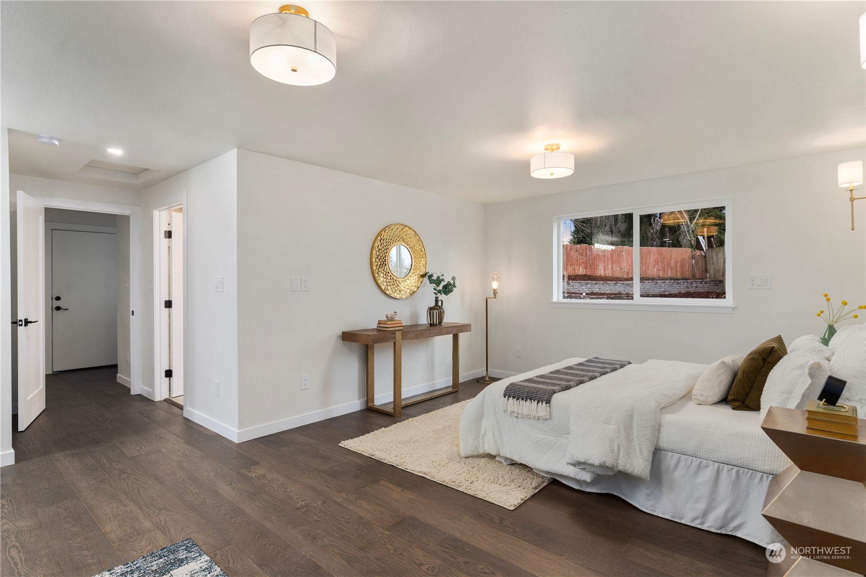 21613 6th Avenue West Bothell, WA 98021 - Photo 19 of 37 a spacious bedroom with a bed and a window