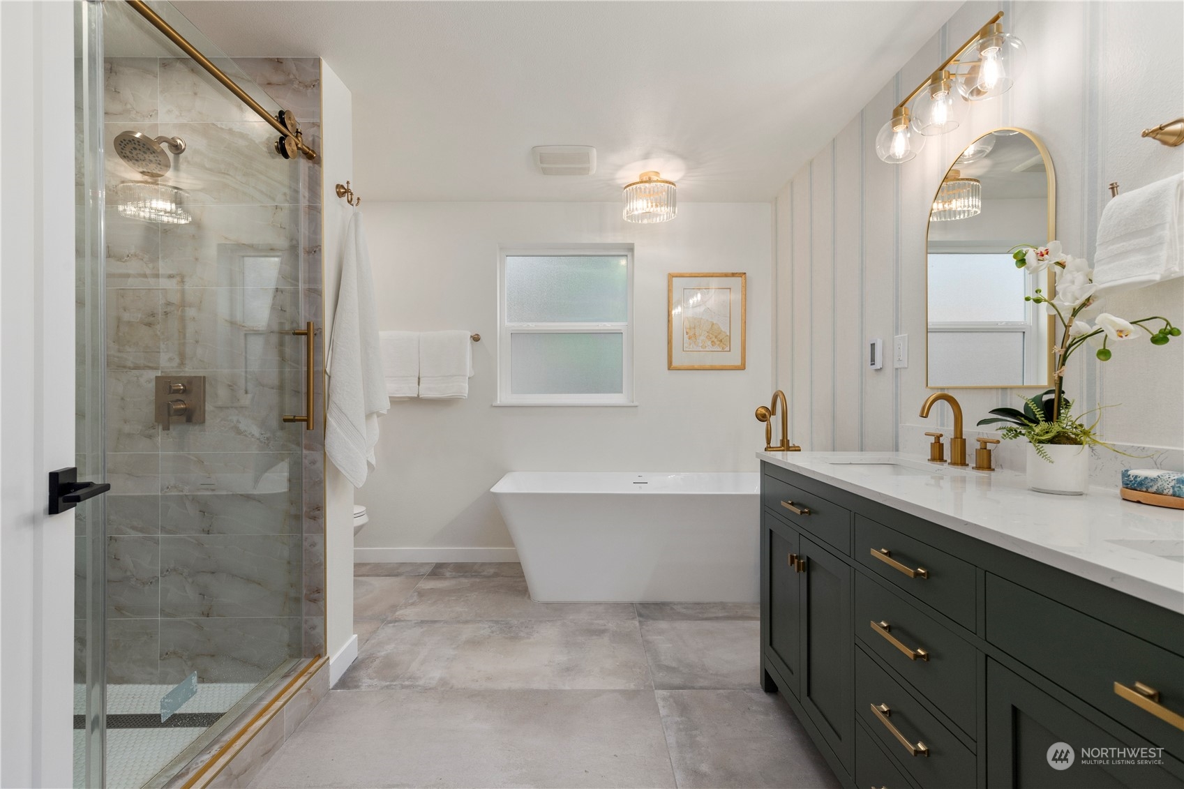 21613 6th Avenue West Bothell, WA 98021 - Photo 23 of 37 a bathroom with a tub sink shower and mirror