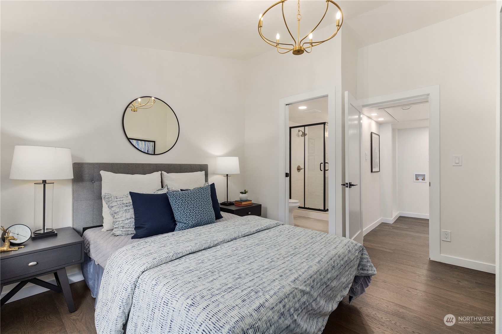 21613 6th Avenue West Bothell, WA 98021 - Photo 28 of 37 a bedroom with bed and a chandelier