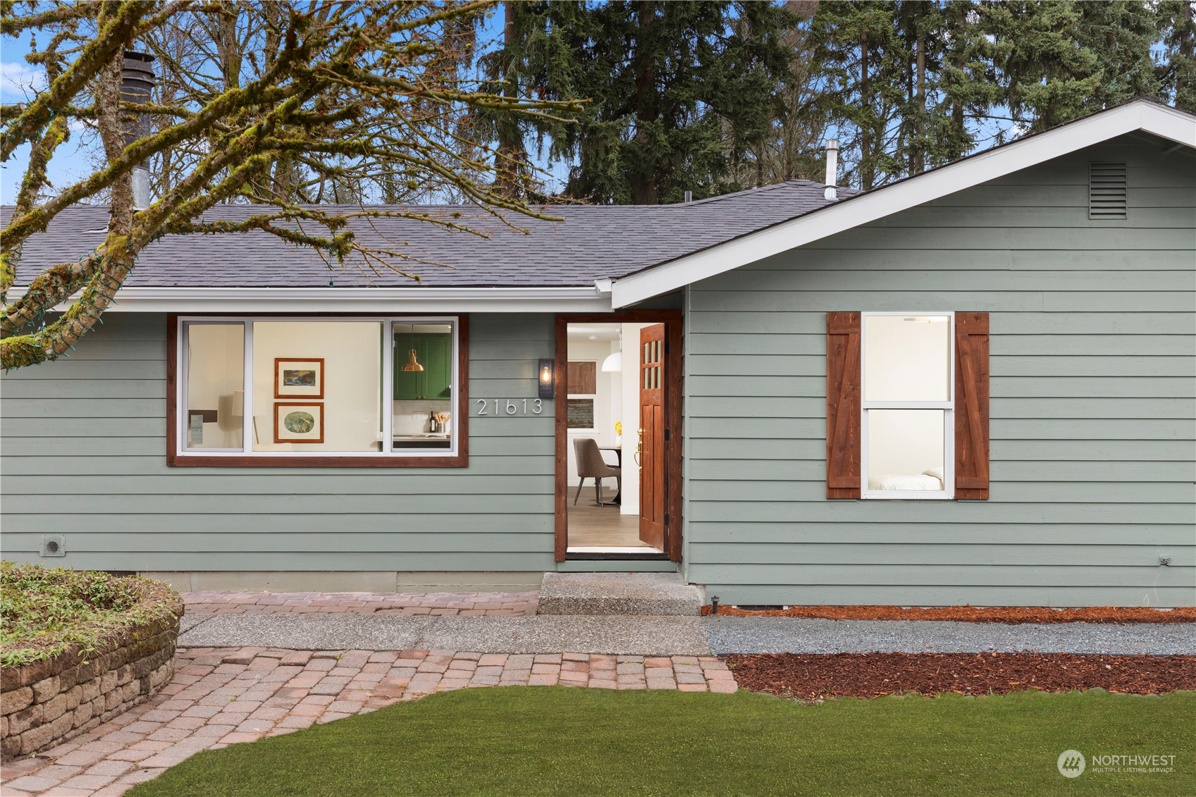 21613 6th Avenue West Bothell, WA 98021 - Photo 3 of 37 a front view of a house with garden