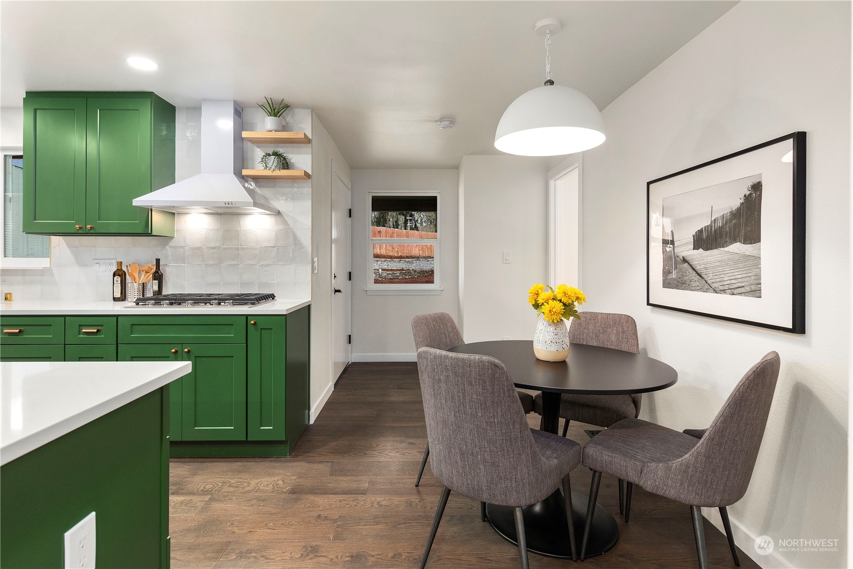 21613 6th Avenue West Bothell, WA 98021 - Photo 9 of 37 a view of a dining room with furniture and a kitchen