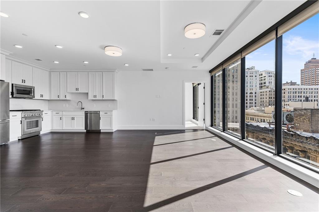 350 Oliver Avenue, Unit 1605 Pittsburgh, PA 15222 - Photo 12 of 40 a large white kitchen with a large window