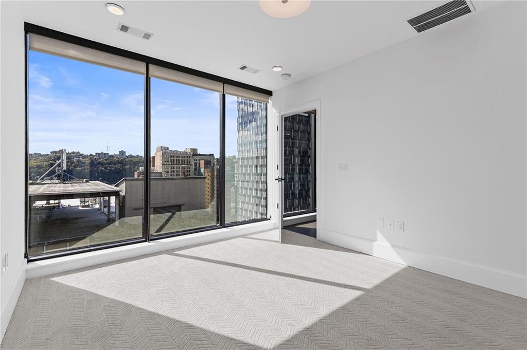 350 Oliver Avenue, Unit 1605 Pittsburgh, PA 15222 - Photo 21 of 40 a view of an empty room with a balcony