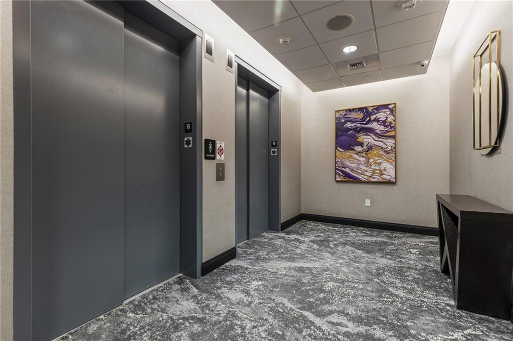 350 Oliver Avenue, Unit 1605 Pittsburgh, PA 15222 - Photo 25 of 40 a view of a hallway with wooden floor