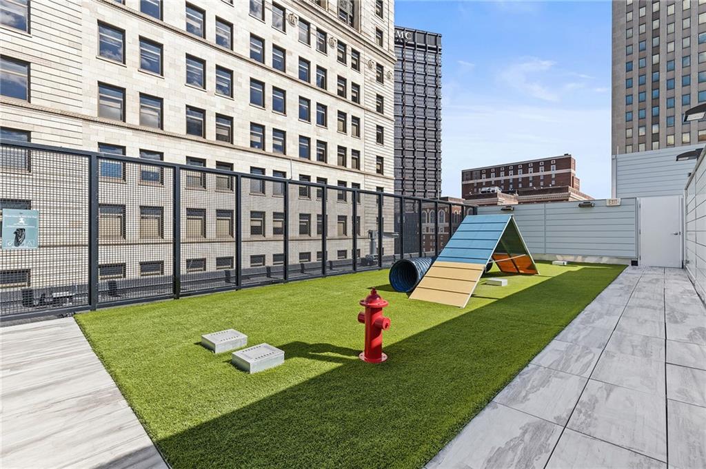 350 Oliver Avenue, Unit 1605 Pittsburgh, PA 15222 - Photo 26 of 40 a view of a swimming pool with a garden