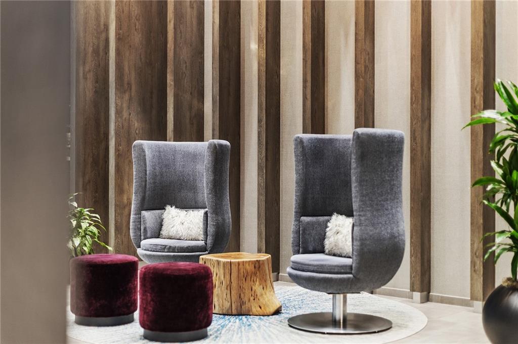 350 Oliver Avenue, Unit 1605 Pittsburgh, PA 15222 - Photo 38 of 40 a living room with furniture and a potted plant