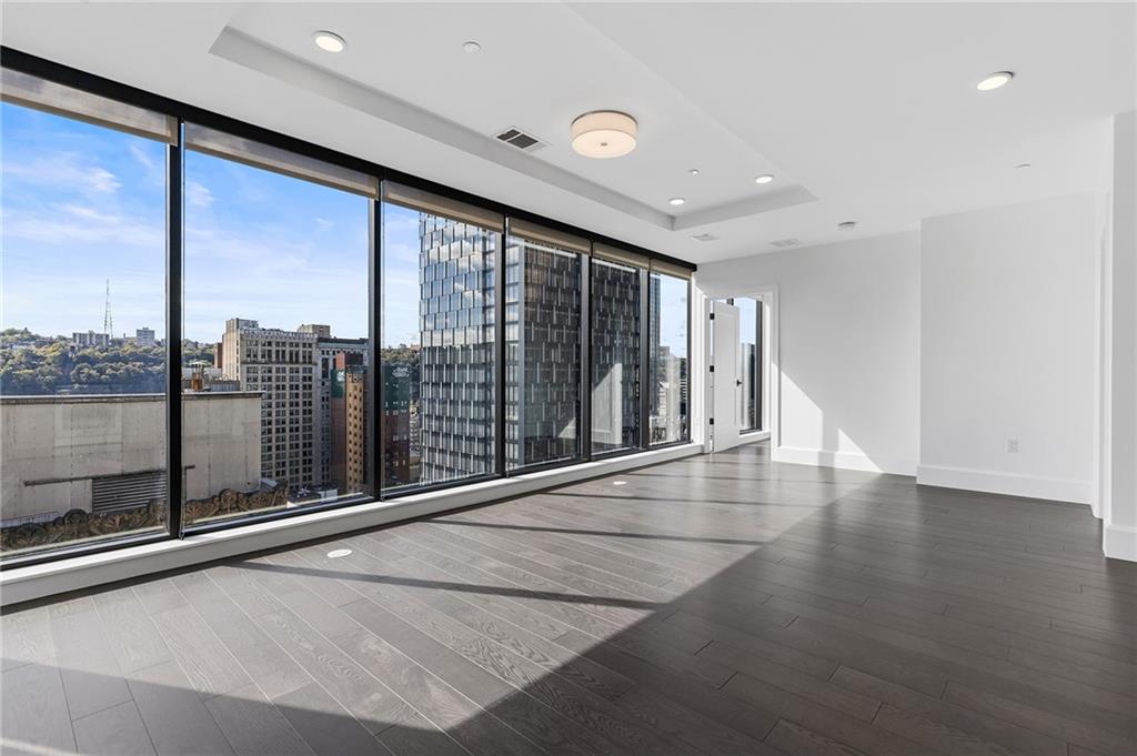 350 Oliver Avenue, Unit 1605 Pittsburgh, PA 15222 - Photo 9 of 40 a view of an empty room with glass door and balcony