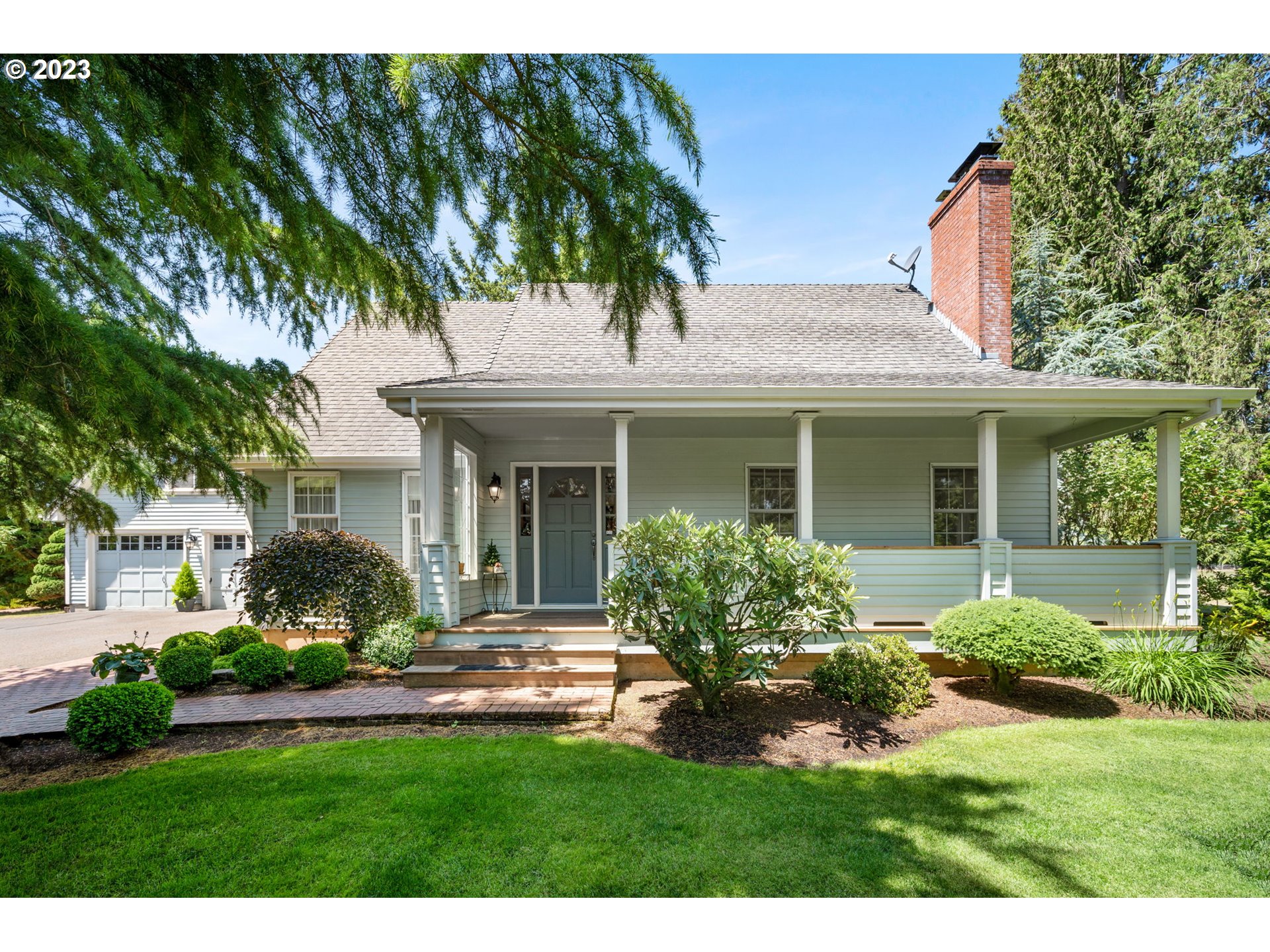 30681 South Needy Road Canby, OR 97013 - Photo 1 of 48 a front view of a house with a yard and potted plants