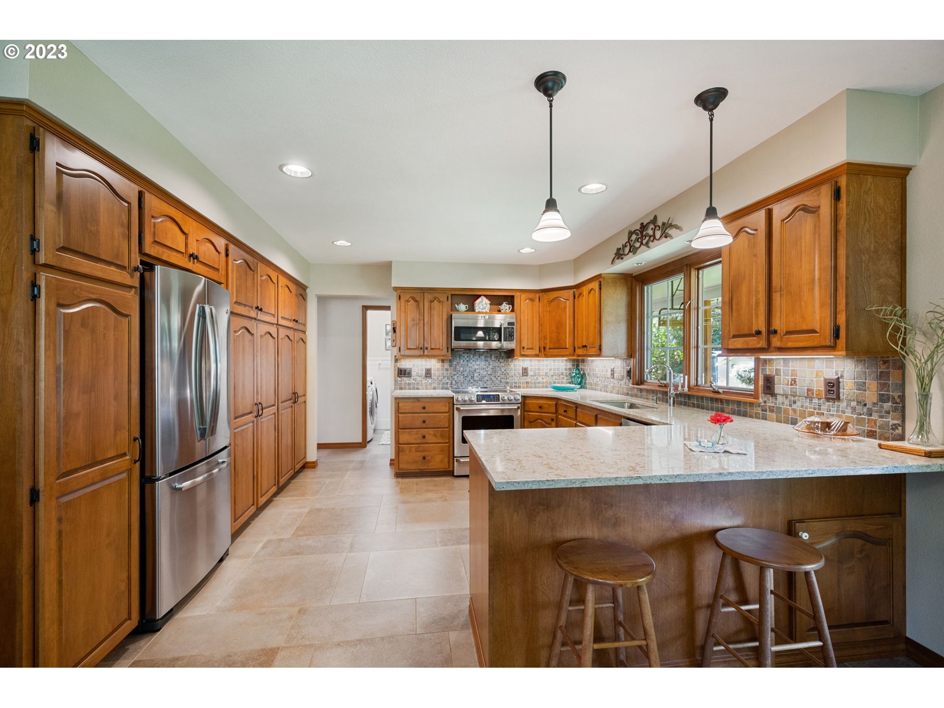 30681 South Needy Road Canby, OR 97013 - Photo 11 of 48 a kitchen with stainless steel appliances granite countertop a refrigerator a sink and a stove
