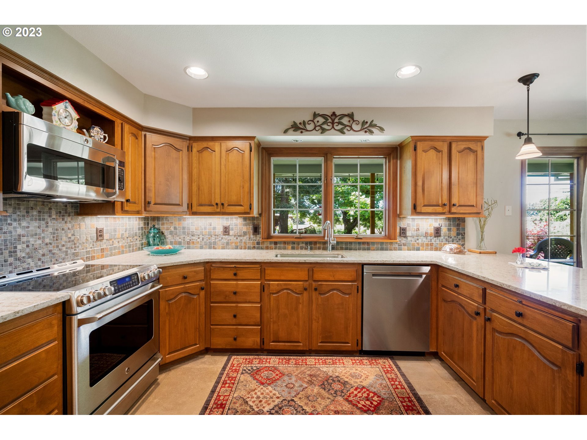 30681 South Needy Road Canby, OR 97013 - Photo 12 of 48 a kitchen with a sink stove and cabinets