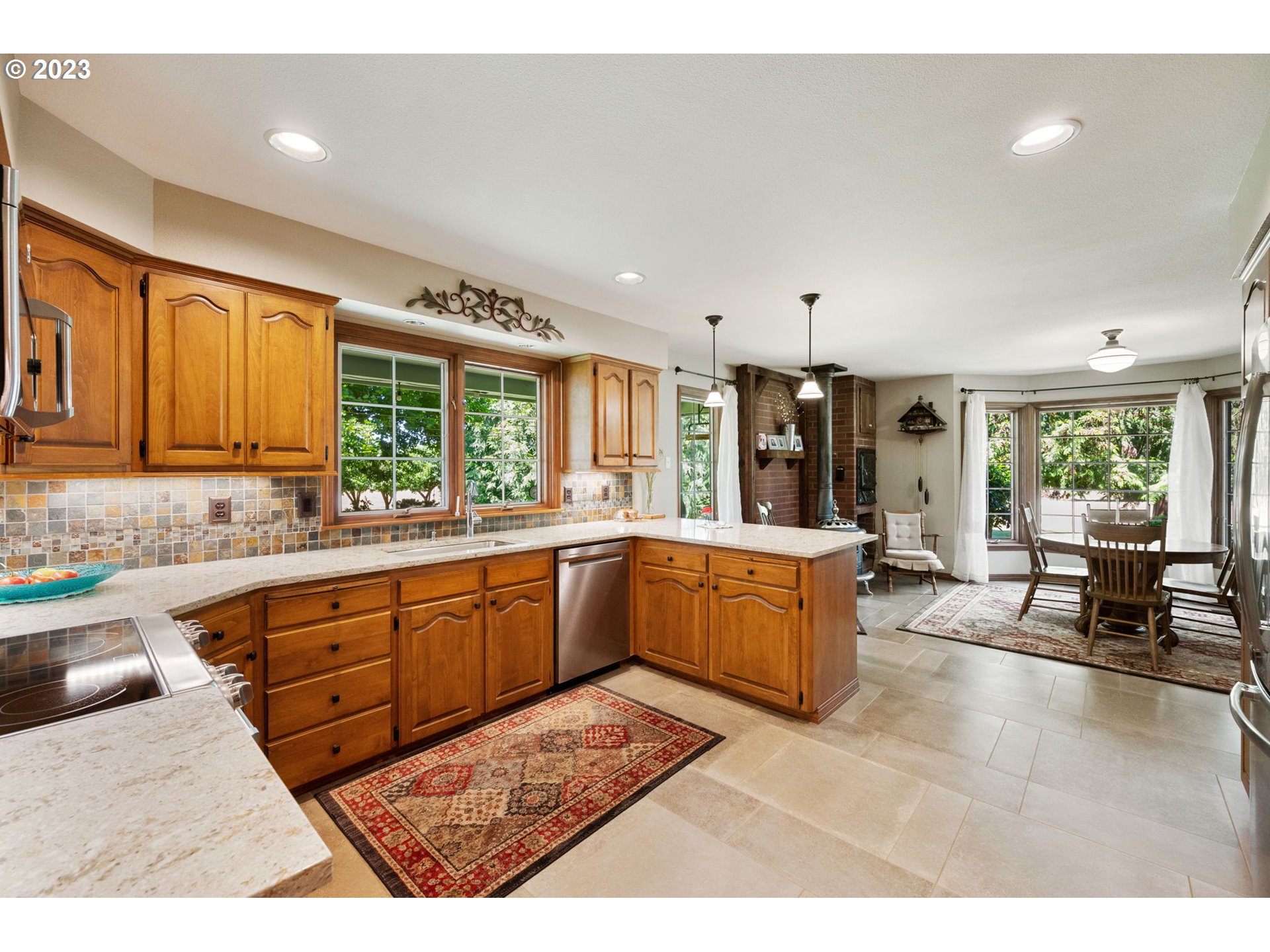 30681 South Needy Road Canby, OR 97013 - Photo 13 of 48 a large kitchen with kitchen island granite countertop a large window