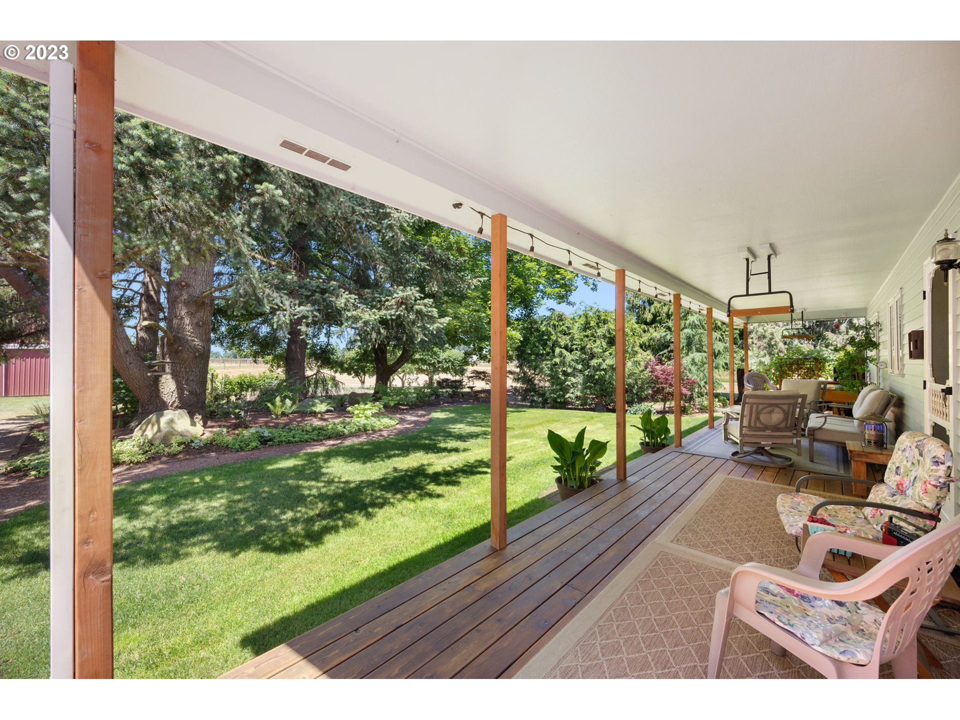30681 South Needy Road Canby, OR 97013 - Photo 29 of 48 a view of a porch with furniture and garden