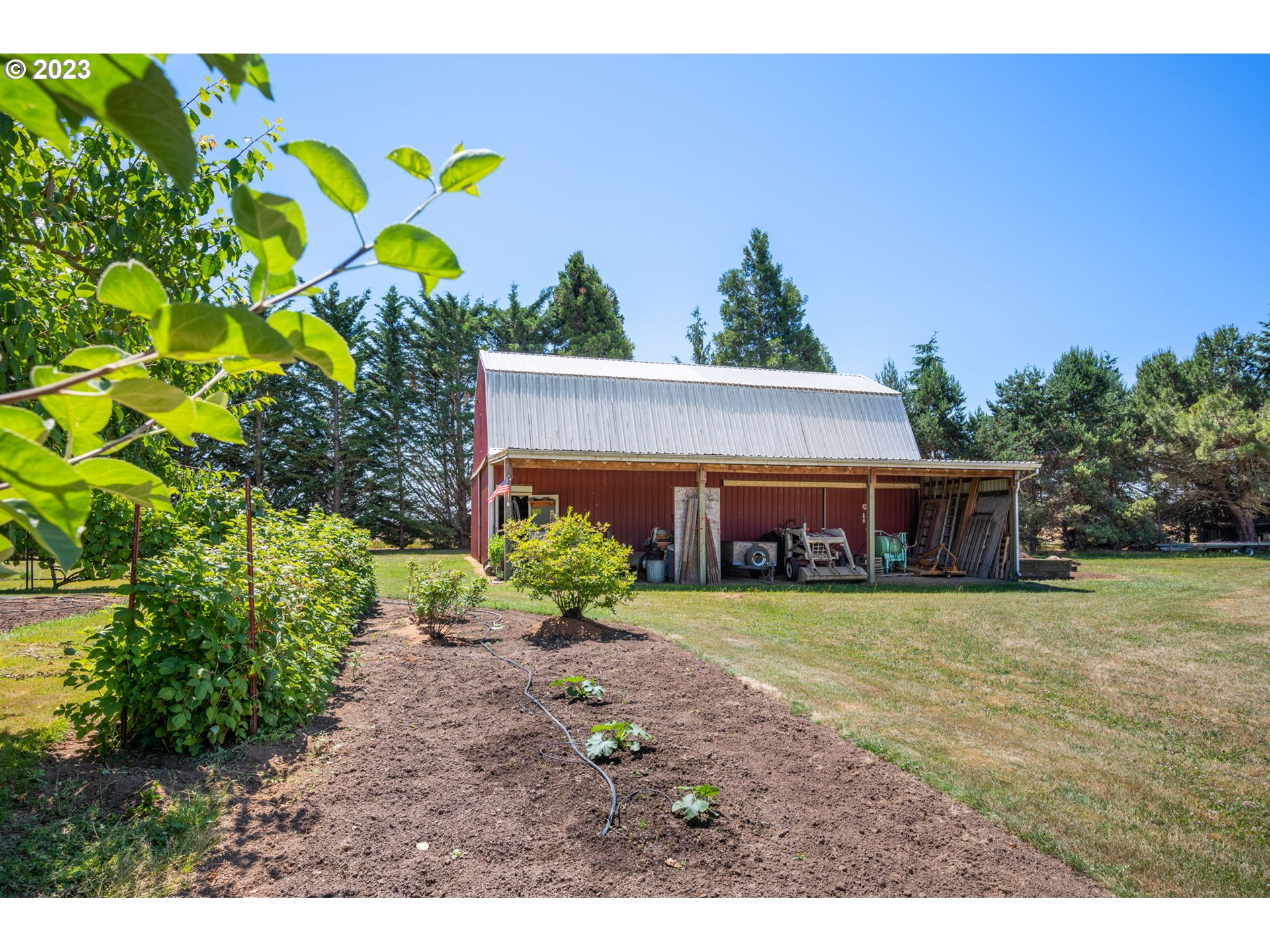 30681 South Needy Road Canby, OR 97013 - Photo 37 of 48 a view of a house with a big yard and a yard