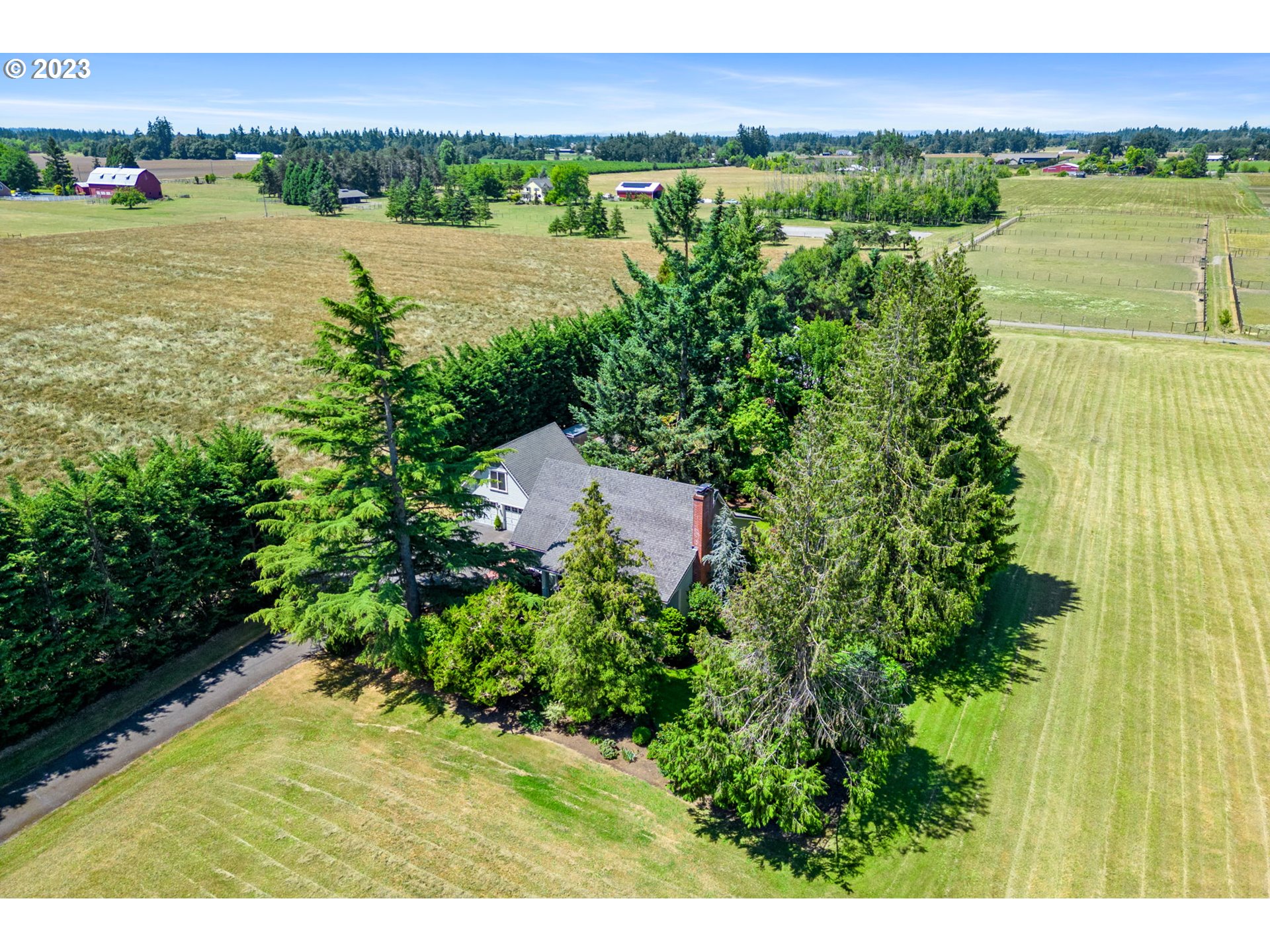 30681 South Needy Road Canby, OR 97013 - Photo 4 of 48 a view of a field with an outdoor space and seating area