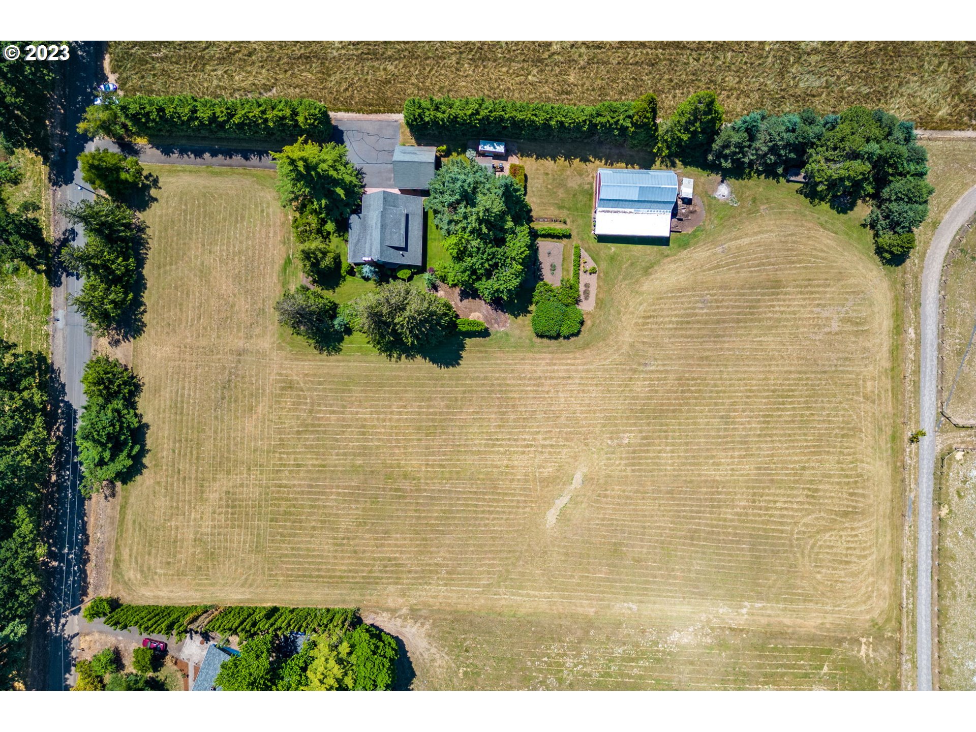 30681 South Needy Road Canby, OR 97013 - Photo 41 of 48 an aerial view of a house with a yard and lake view