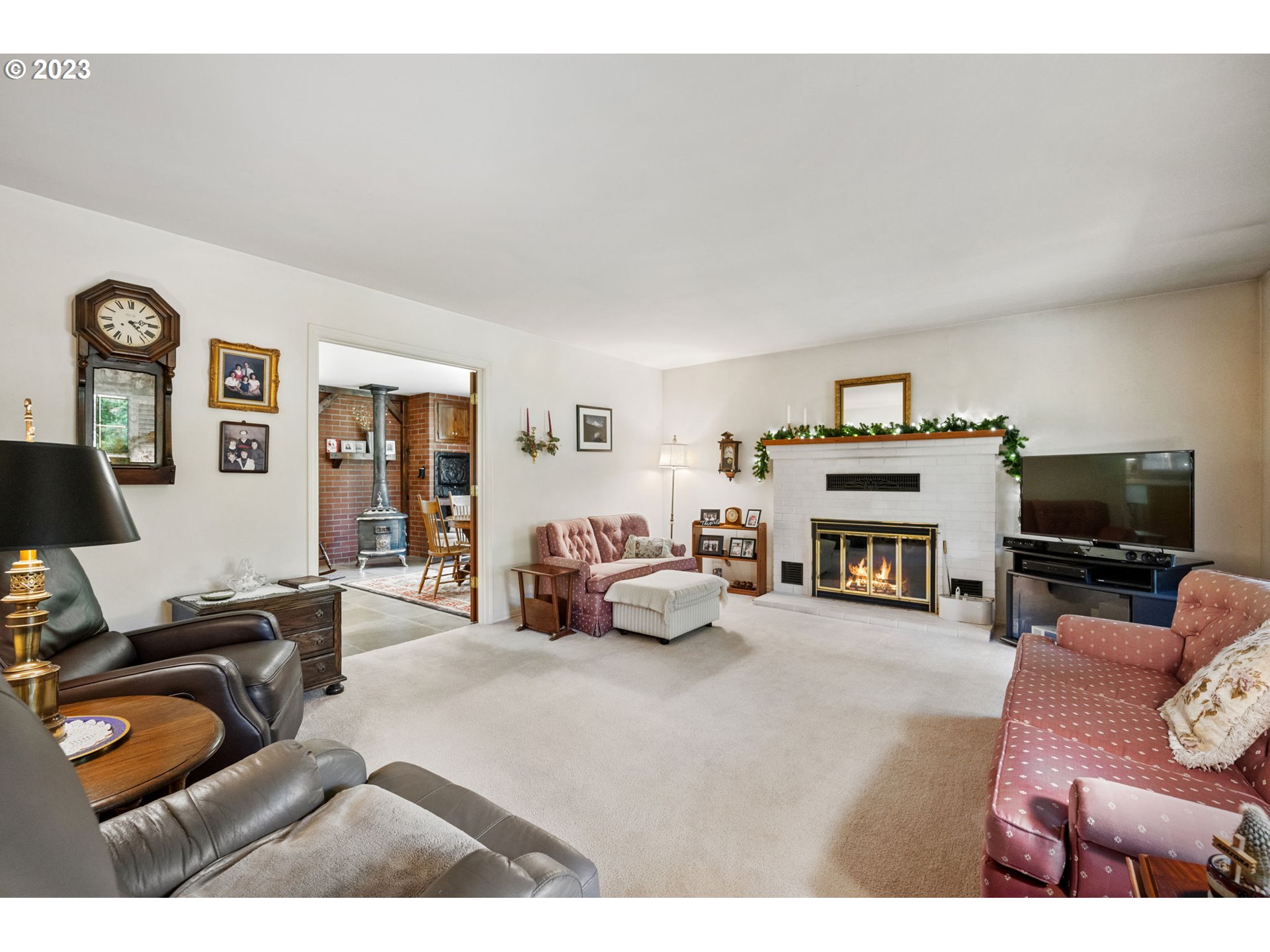 30681 South Needy Road Canby, OR 97013 - Photo 7 of 48 a living room with furniture and a flat screen tv