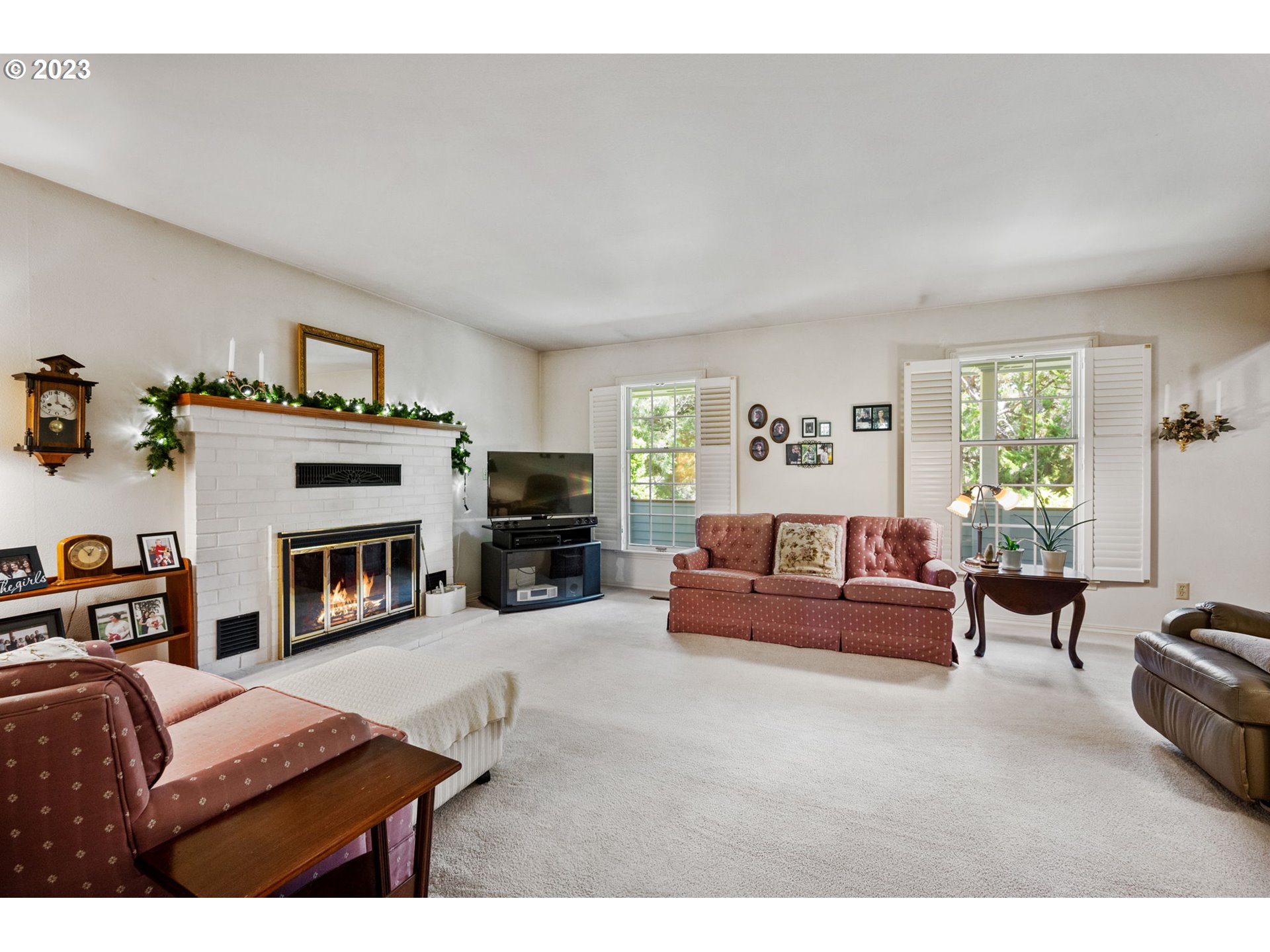 30681 South Needy Road Canby, OR 97013 - Photo 8 of 48 a living room with furniture a fireplace and a large window