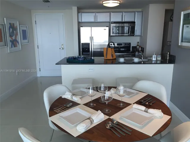 a view of a table and chairs in the kitchen