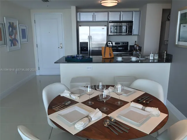 a view of a balcony with chair and table