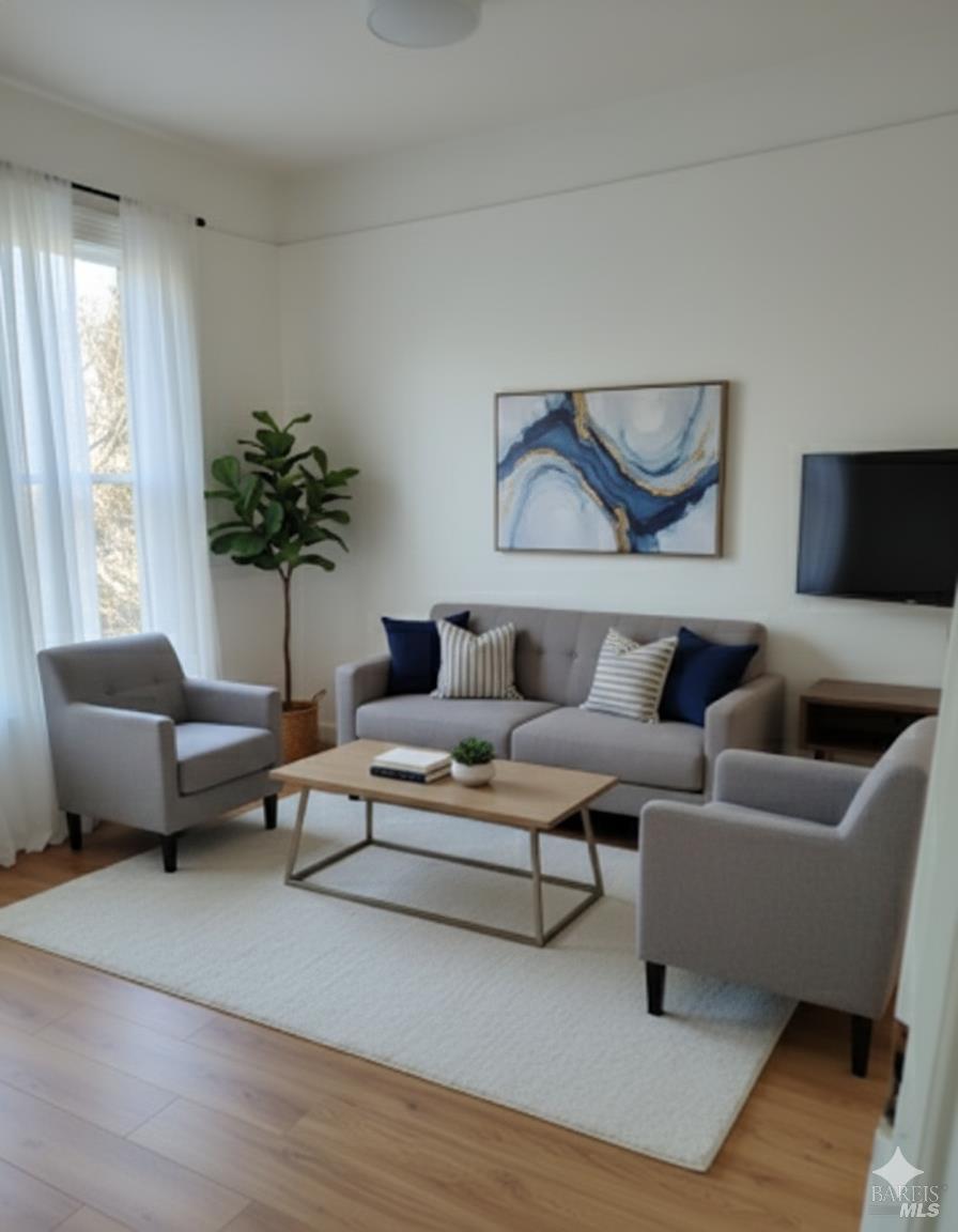 627 Maine Street, Unit D Vallejo, CA 94590 - Photo 2 of 5 a living room with furniture and a potted plant