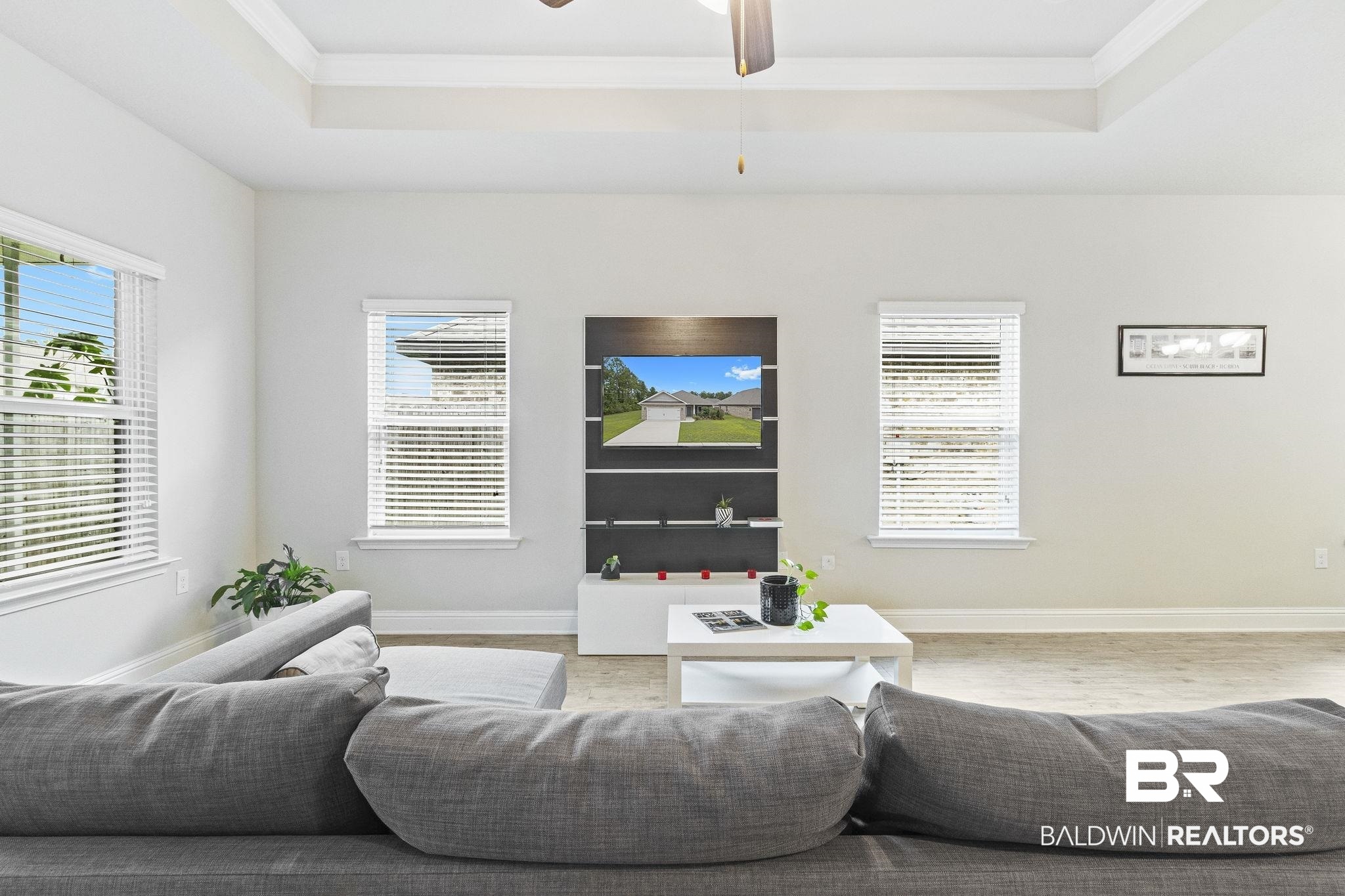 31643 Kestrel Loop Daphne, AL 36527 - Photo 7 of 59 Living room featuring crown molding, ceiling fan, and hardwood / wood-style flooring