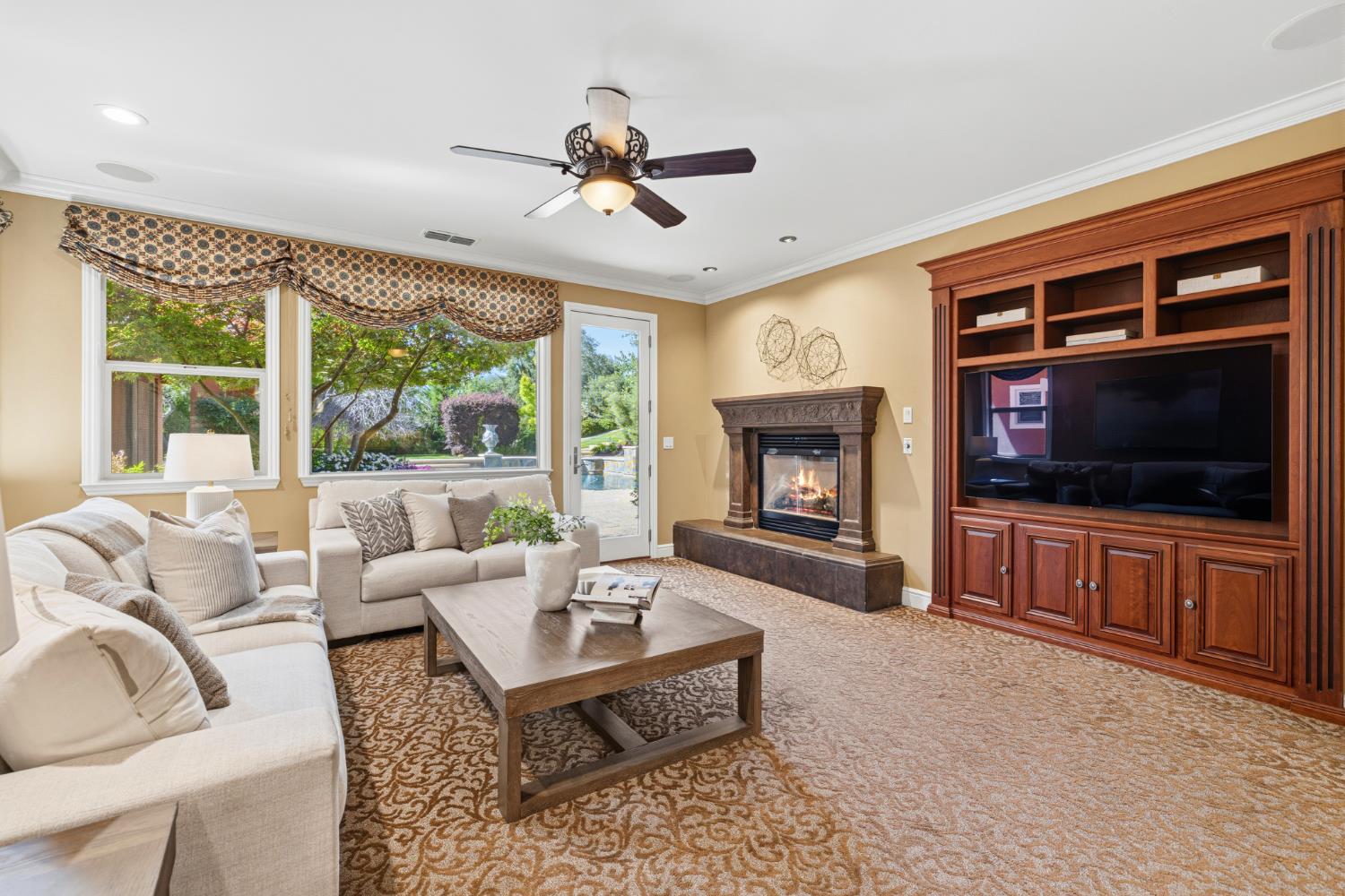 3047 Travois Circle Rescue, CA 95672 - Photo 11 of 94 a living room with furniture a flat screen tv and a fireplace