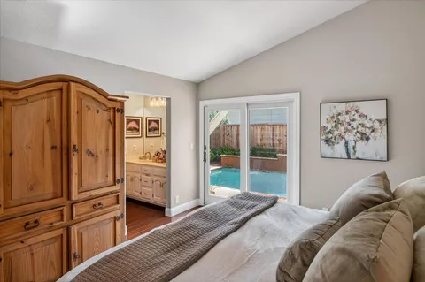 a bedroom with furniture and a gate