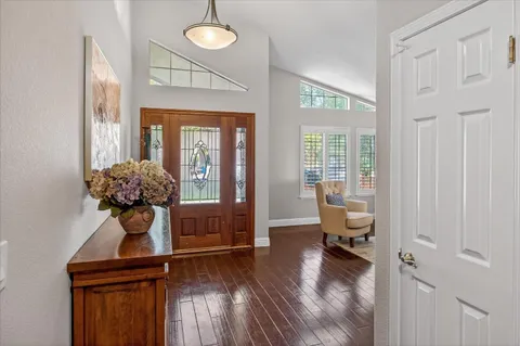 a view of a livingroom with furniture and hardwood floor