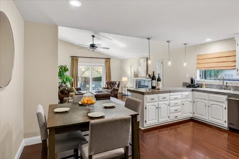 a kitchen with a sink appliances and cabinets