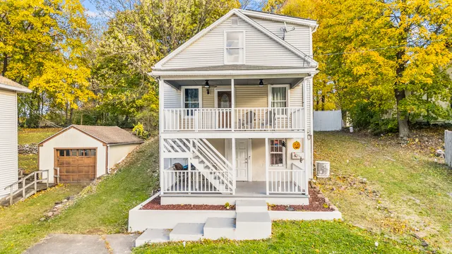 a front view of a house with a yard