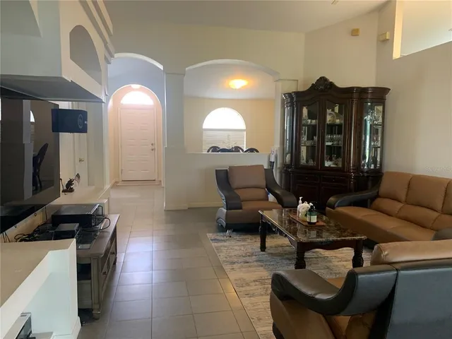 a living room with furniture and a large window