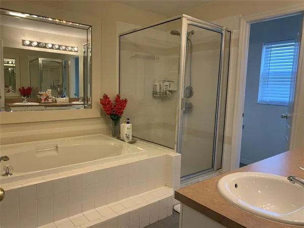 a bathroom with a tub and a sink