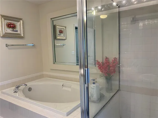 a bathroom with a tub and shower