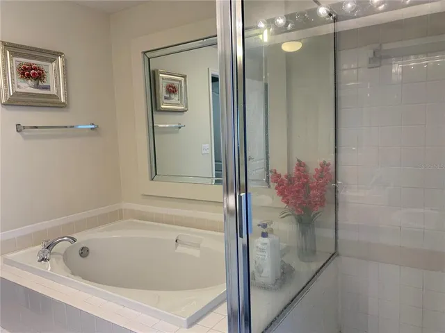 a bathroom with a tub and shower