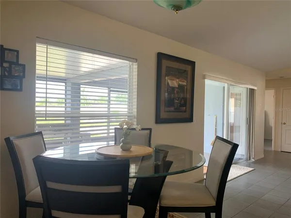 a view of a dining room with furniture window and outside view