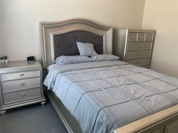 a bedroom with a bed and a cabinets
