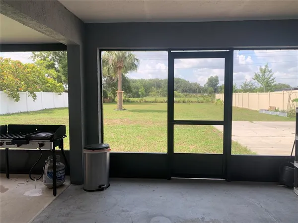 a view of an empty room with a large window