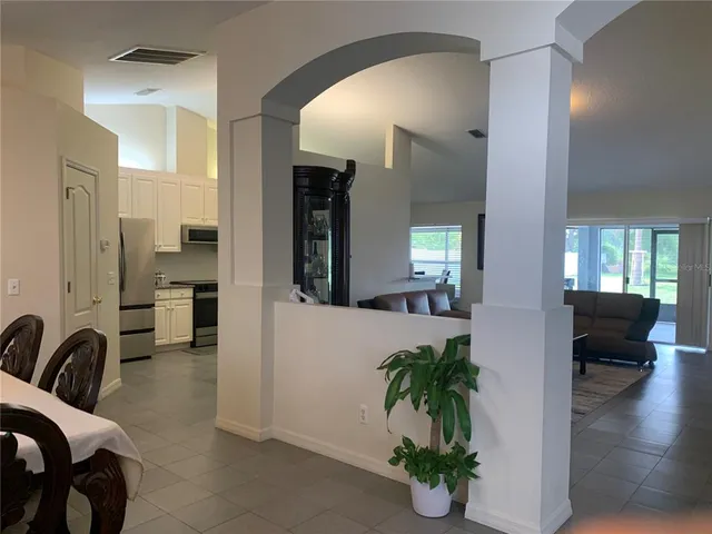 a view of a livingroom with furniture and a potted plant