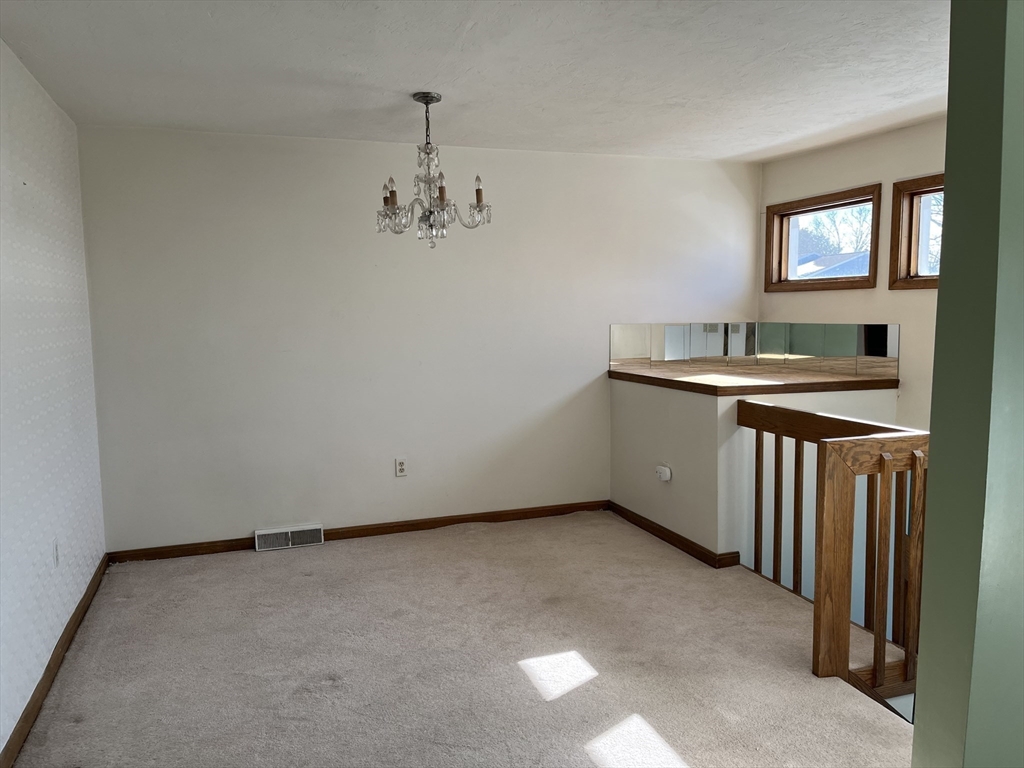 51 Londonderry Road, Unit 51 Grafton, MA 01519 - Photo 4 of 32 a view of an empty room with a sink