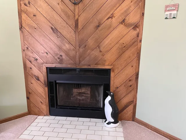a stone fireplace with a fireplace