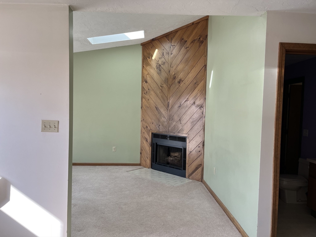 51 Londonderry Road, Unit 51 Grafton, MA 01519 - Photo 9 of 32 a view of a livingroom with a fireplace
