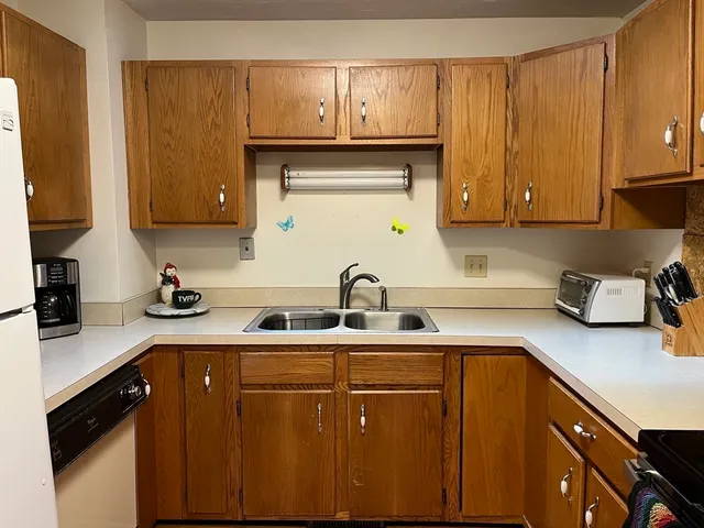 a kitchen with a sink and cabinets